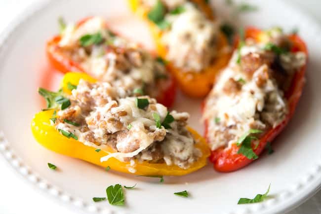 Sausage Stuffed Mini Sweet Peppers Appetizer Recipe - These stuffed mini sweet peppers are the perfect bite-size poppers are so delicious and so easy to make!